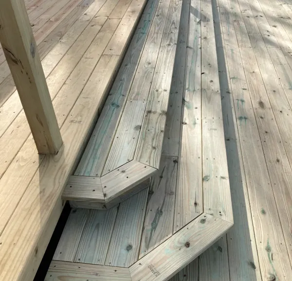 Custom deck steps and bench detail by Peak Home Improvement