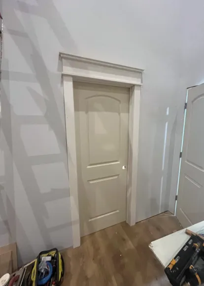 Custom door trim and crown molding with LVP flooring